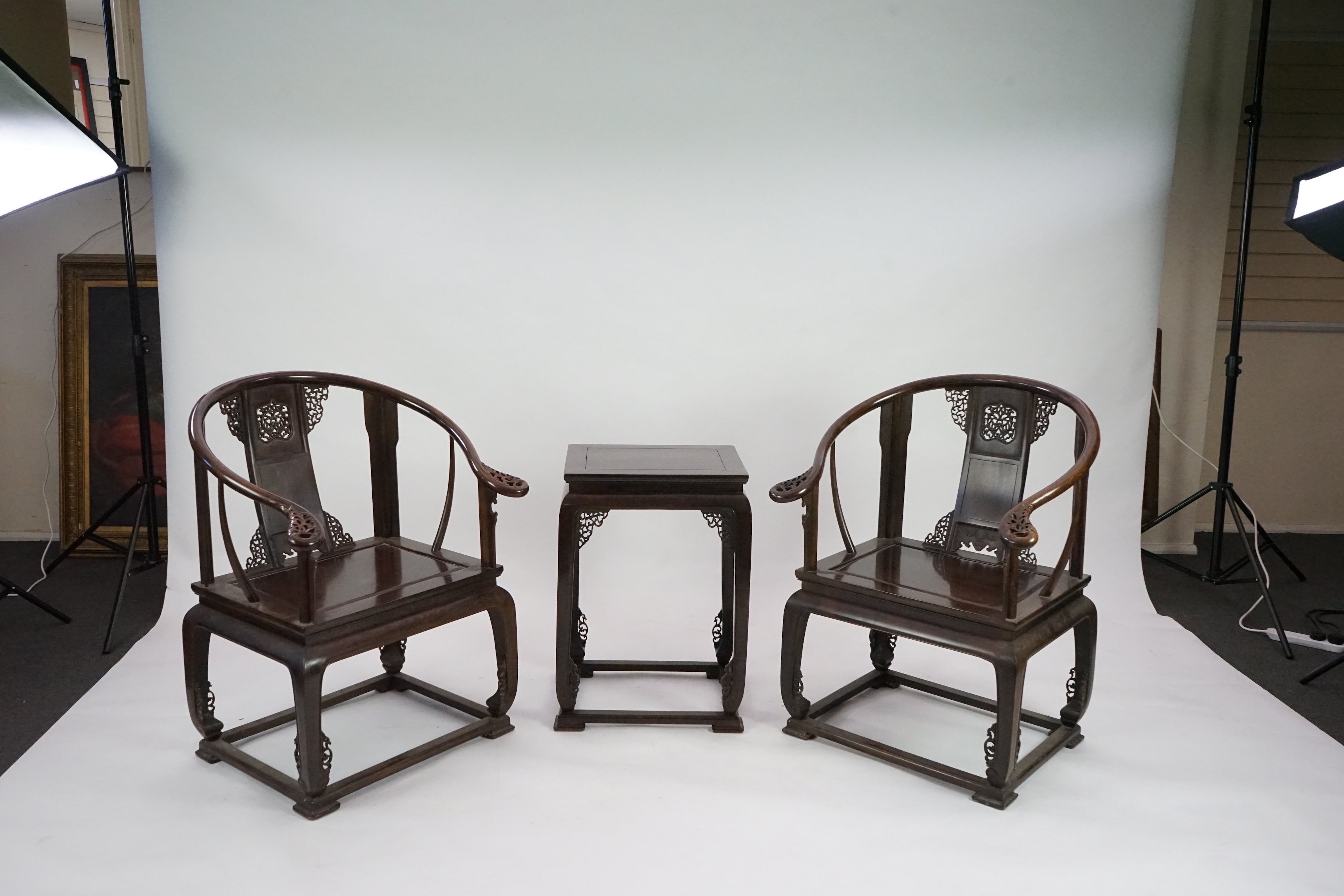 A pair of Chinese jichimu horseshoe shaped armchairs and a matching table, 19th/20th century